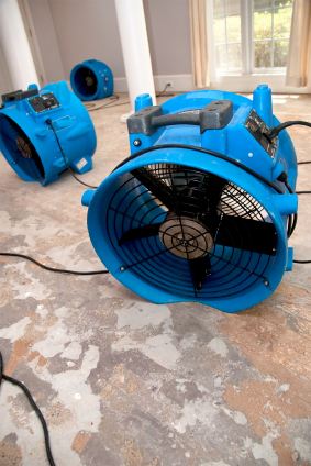 Commercial fans drying a water damaged living room in a Balboa Island, CA home.